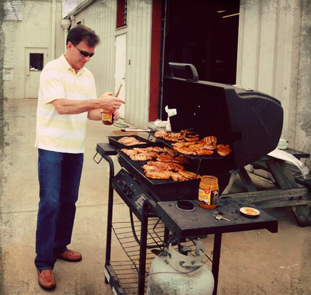 Keith Smith at his grill, cooking with Shop Sauce
